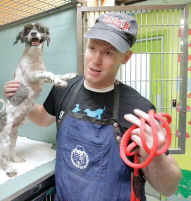 Imhof holding happy rescue dog